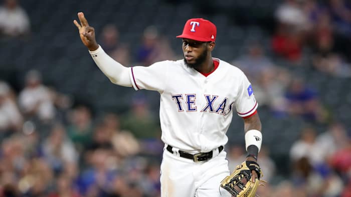 Aug 16, 2018; Arlington, TX, USA; Texas Rangers third baseman Jurickson Profar (19) reacts after the Texas Rangers record a triple play during the fourth inning against the Los Angeles Angels at Globe Life Park in Arlington.